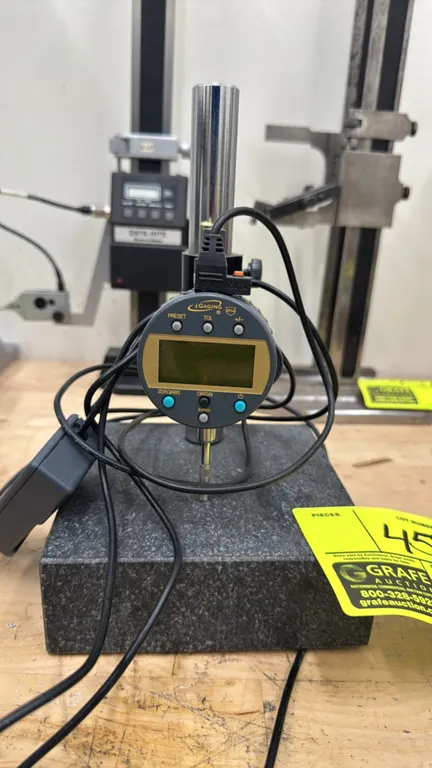 iGaging digital indicator mounted on a granite comparator stand. Features an IP54-rated digital dial indicator with in/mm conversion, zero/ABS, preset