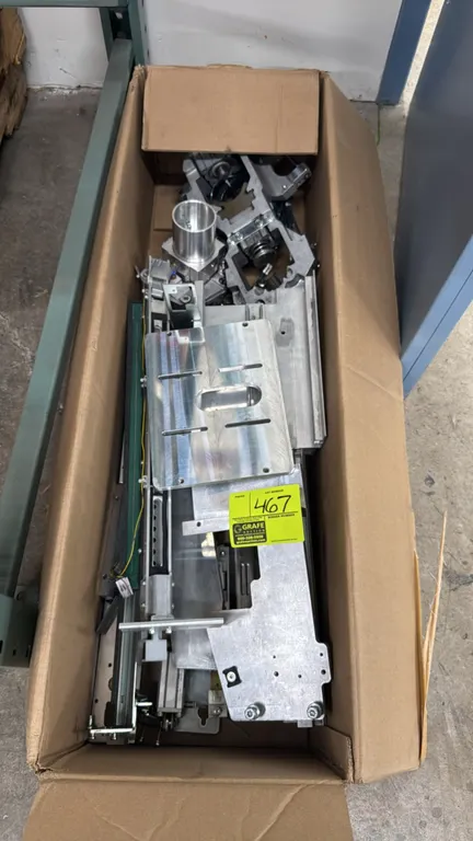 Assorted machined aluminum parts and hardware assemblies. Includes slotted mounting plates, brackets, structural components, and linear rail elements.
