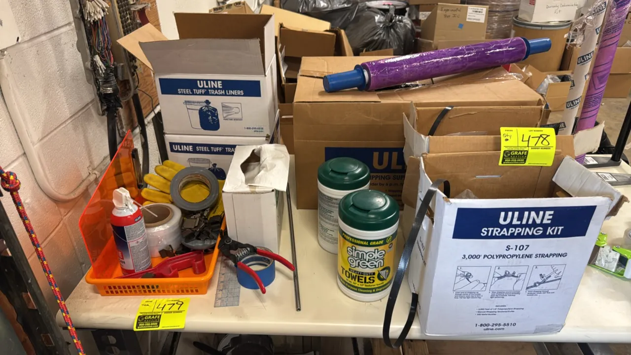 Package lot of assorted warehouse and packaging supplies. Includes Uline polypropylene strapping kit (model S-107), Uline Steel Tuff trash liners, Sim