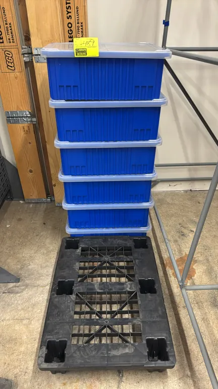 Quantum Storage Systems poly storage tubs with lids and dividers. Includes (6) blue plastic containers with clear lids, interior dividers, and (1) bla
