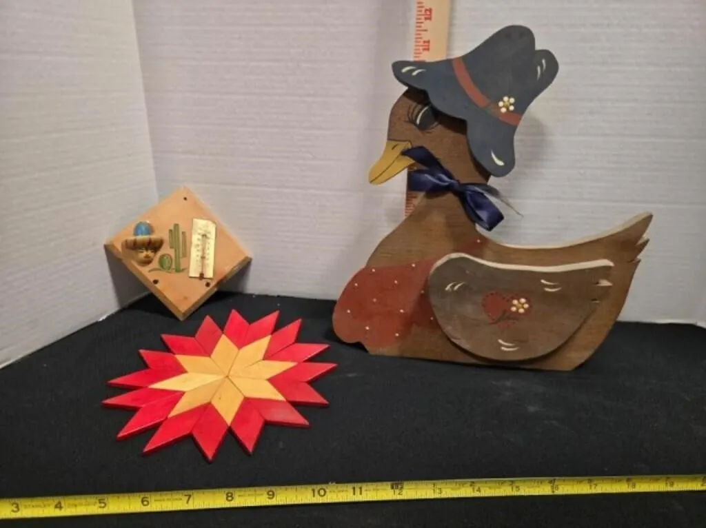 Wood duck statue, wooden trivet, thermometer