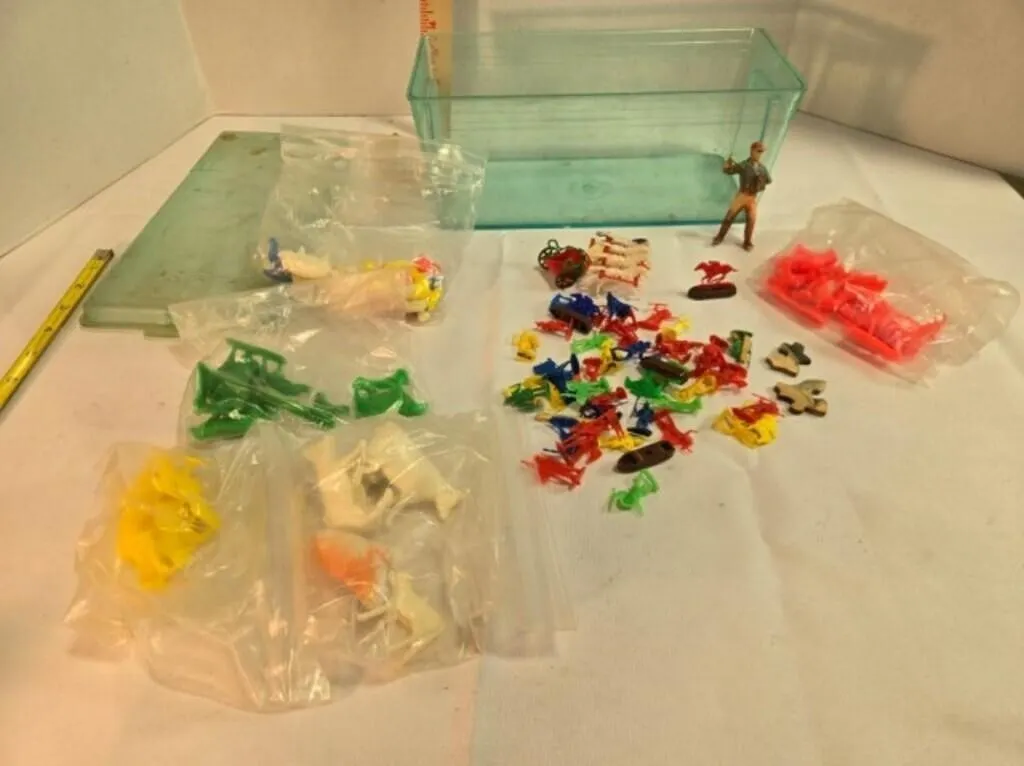 Plastic container w/plastic toy pieces