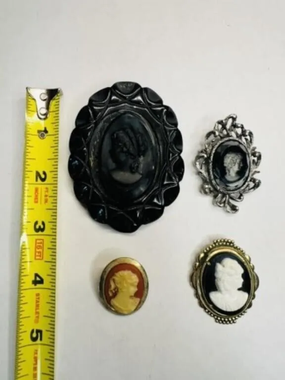 4 Cameo Brooches, Black Lucite has been repaired,