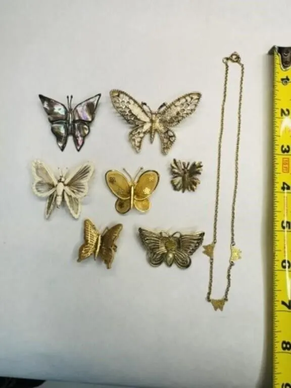 7 Butterfly Brooches, 1 necklace-brooches marked
