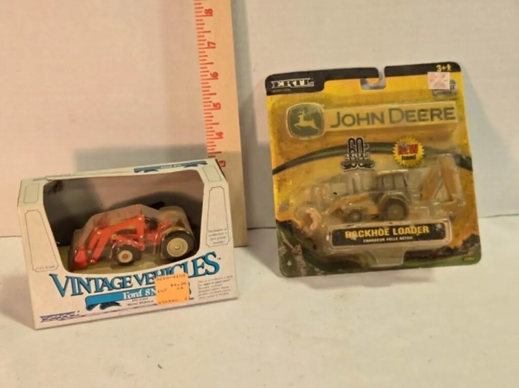 2 ERTL vehicle models in original packaging