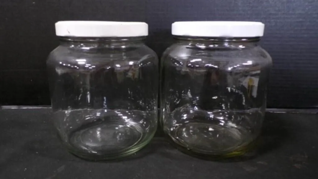 2 Glass Storage Bottled Jars w/ Metal Covers
