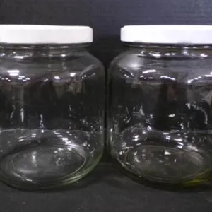 2 Glass Storage Bottled Jars w/ Metal Covers