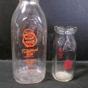 2 Vintage Orange Pyroglaze Labeled Milk Glasses