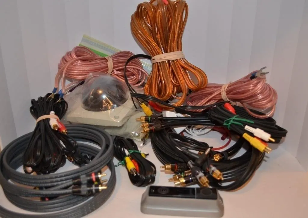 Assortment of used audio and video cables, speaker