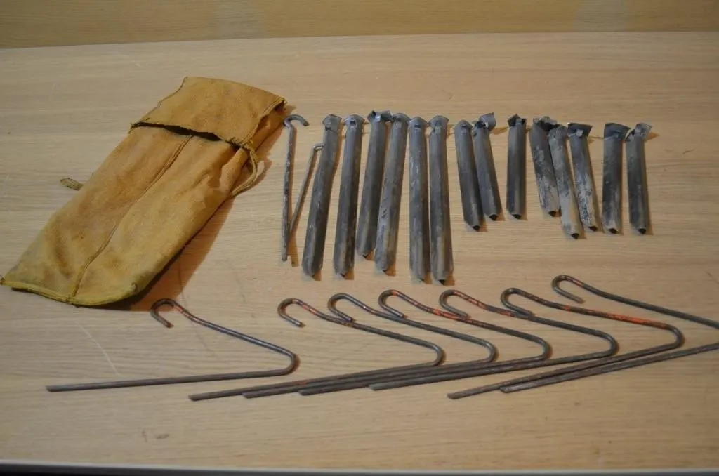 Vintage metal tent pegs and wire-hook ground