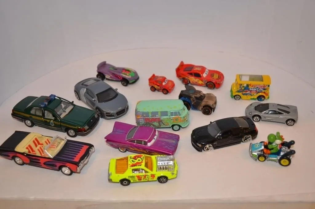 Assorted toy cars and vehicles, including die-cast