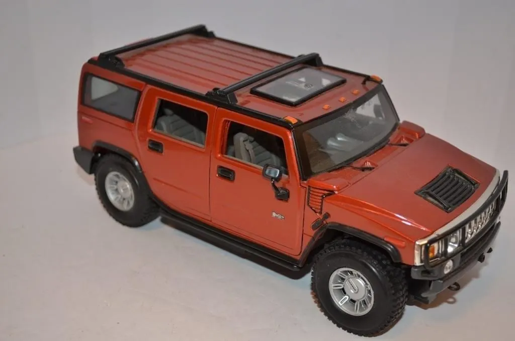 Metallic orange 1/18th 2003 Hummer H2 SUV diecast