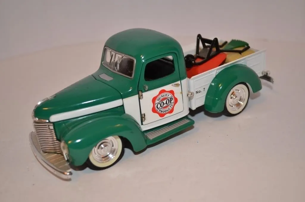 Two-tone green and white die-cast toy pickup truck