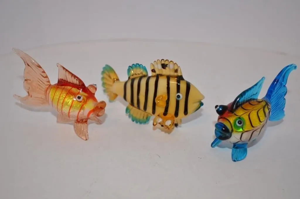Hand-blown glass fish figurines feature vibrant