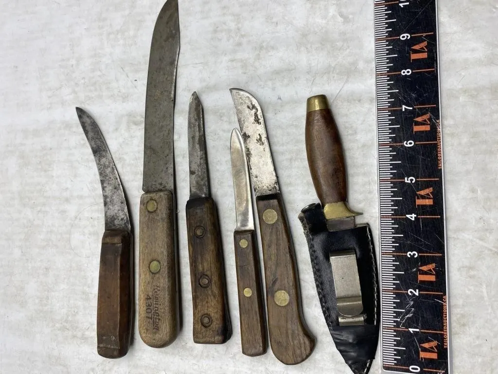 Vintage fixed-blade knives with leather sheath,