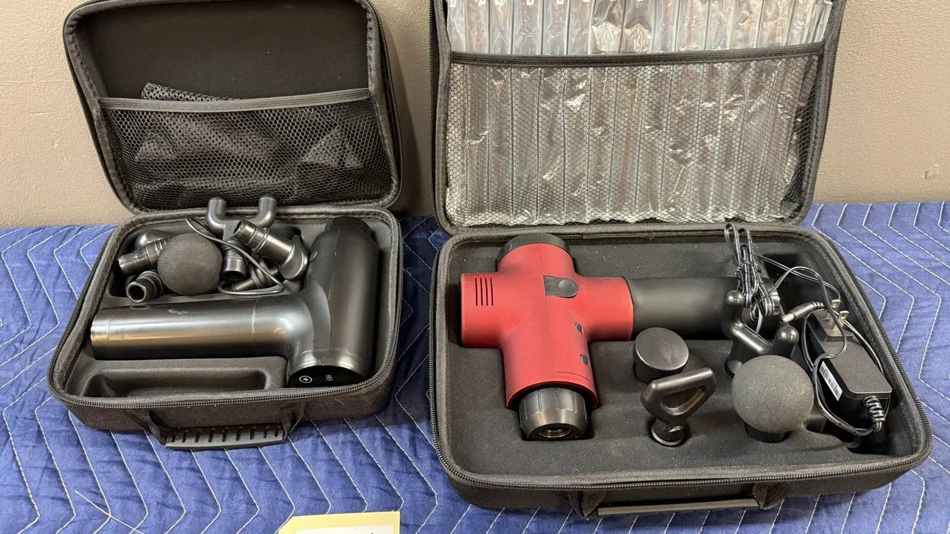 Two Massage Guns with Attachments and Cases