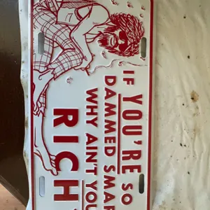 Novelty License Plate With Humorous Quote and Cartoon Figure