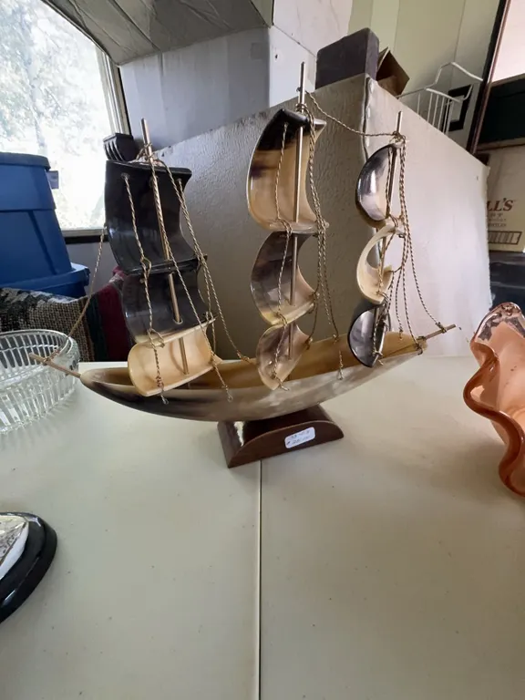 Sailing Ship Model With Horn Sails and Wood Base