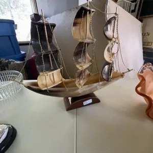 Sailing Ship Model With Horn Sails and Wood Base