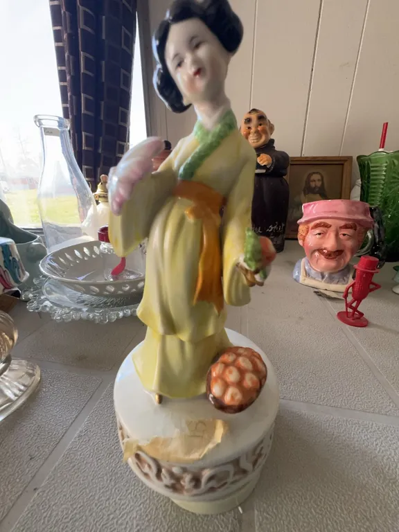 Porcelain Geisha Figurine Music Box with Yellow Kimono and Floral Accents