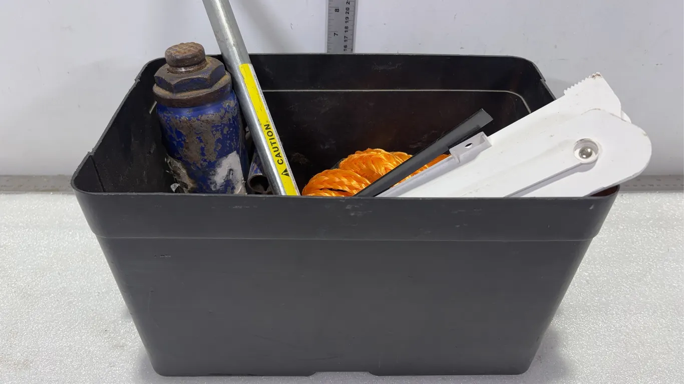 Bin w/ Hydraulic Jack, Folding Emergency Reflective Triangle, and Tow Rope w/ Hooks, Approx. 5 Items In Bin *Unreserved*