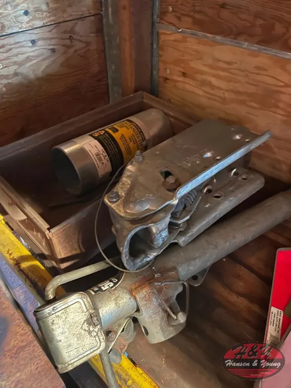 Jack, Trailer Hitch and Roll of Galvanized Steel