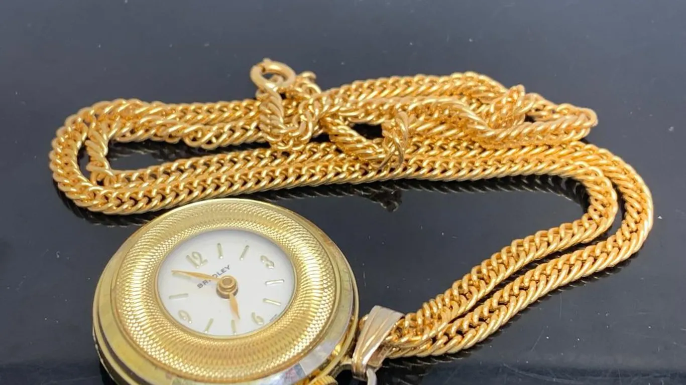 Bradley Gold Tone Swiss Pendant Watch