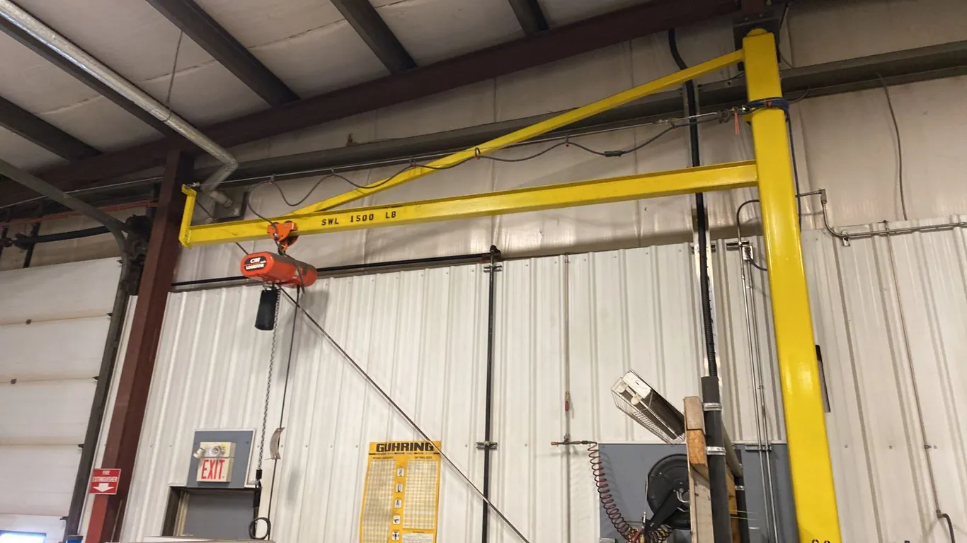 1 1/2 TON JIB CRANE. BUYER TO REMOVE. APPROX 16' BOOM, BEARING SWIVEL. CM LOADSTAR HOIST WITH