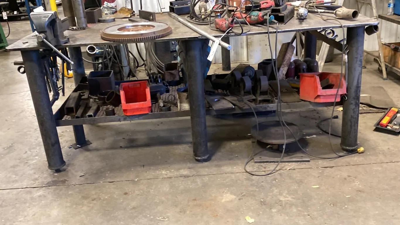 8' X 4' WELDING TABLE. 3/4" SOLID TOP. ADJUSTABLE LEGS. HEAVY. INC 6" IRWIN VISE.