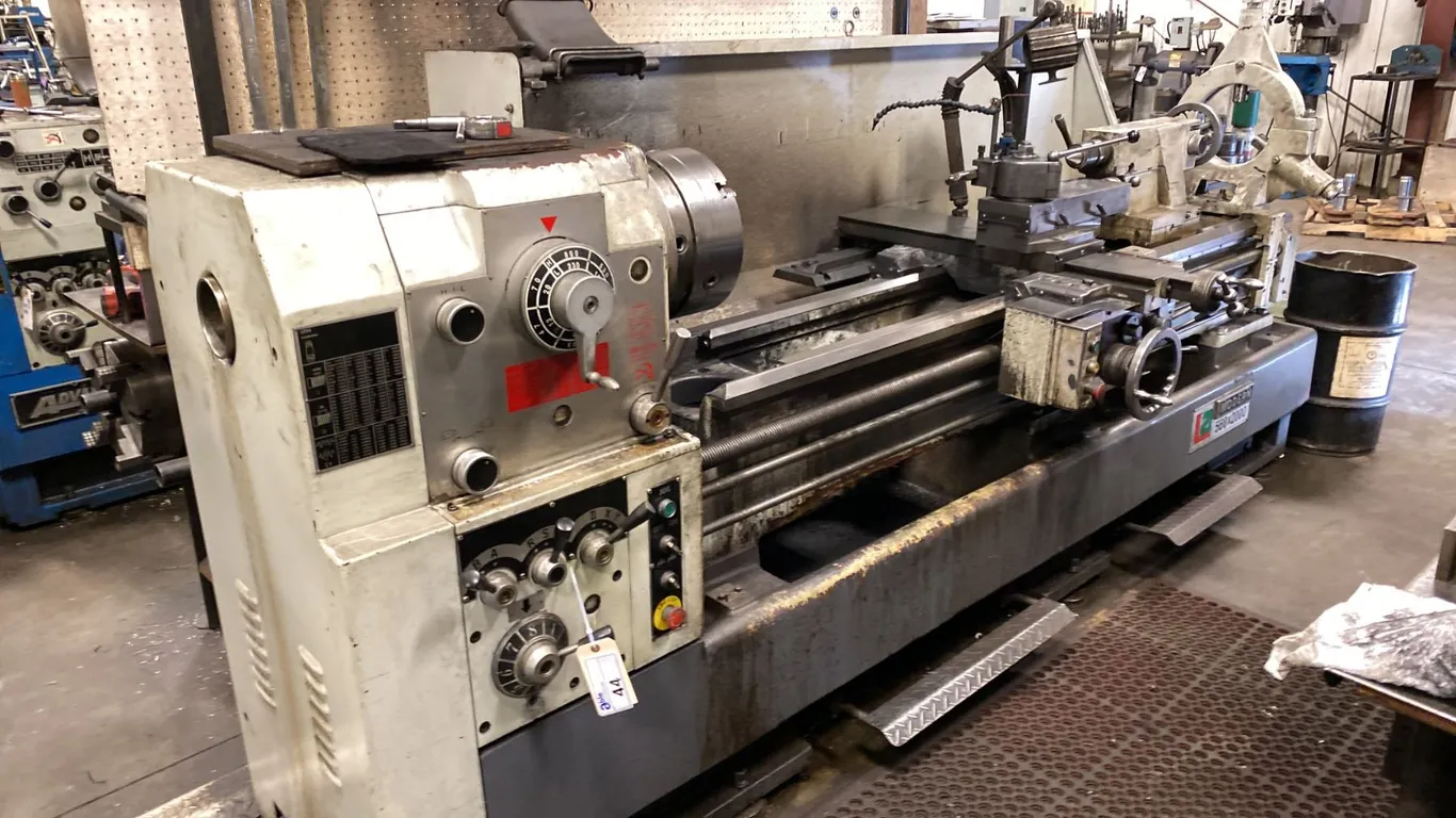 MODERN LA 560 X 2000 LATHE. 3 PHASE. COMES WITH ASST TOOLING, QUICK RELEASE TOOLING MOUNT,