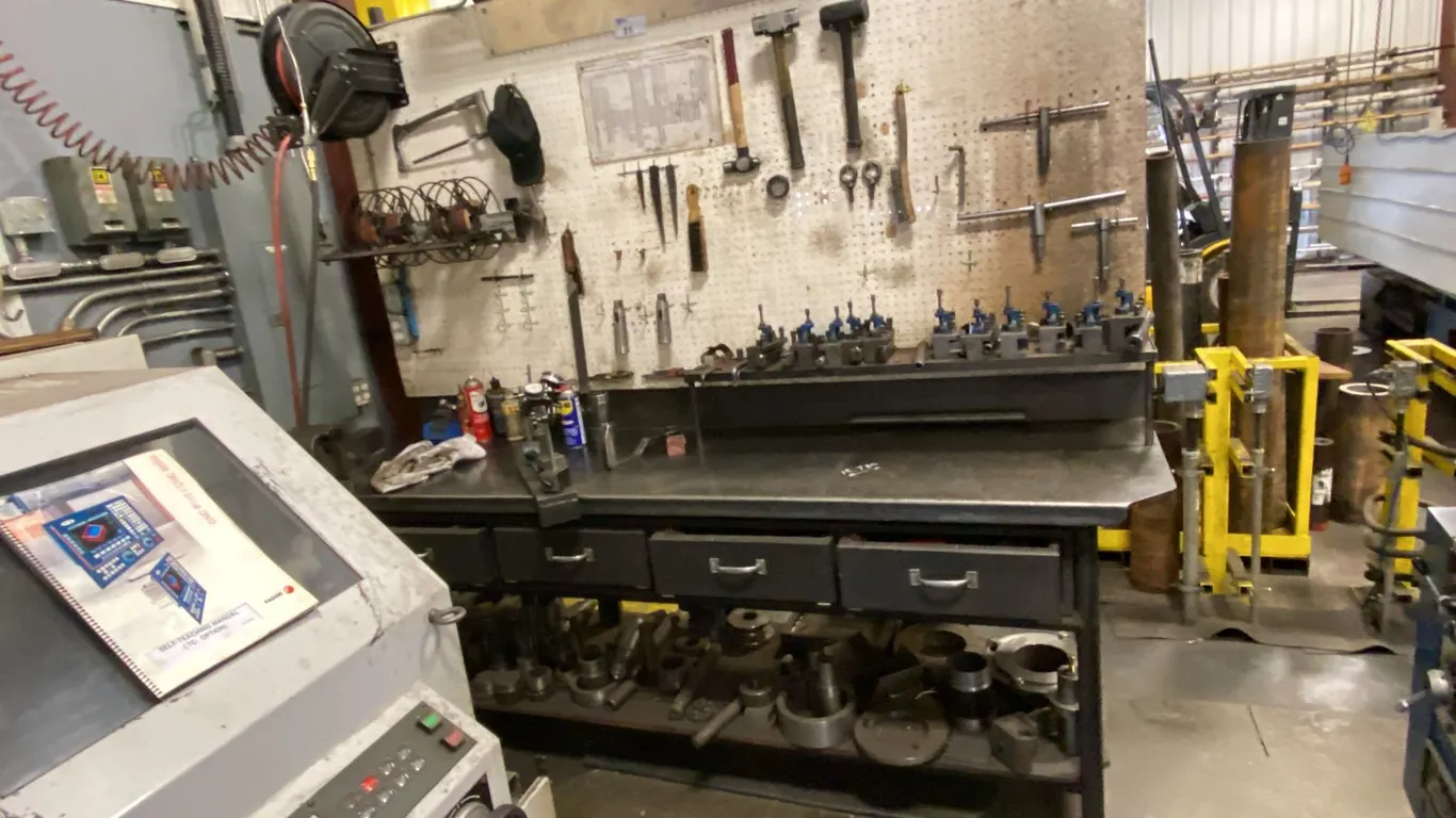 8' METAL WORK BENCH. 4 DRAWERS, 6" VISE, PEGBOARD, 4' OVERHEAD LIGHT, RETRACTABLE HOSE REEL,