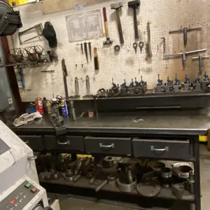 8' METAL WORK BENCH. 4 DRAWERS, 6" VISE, PEGBOARD, 4' OVERHEAD LIGHT, RETRACTABLE HOSE REEL,