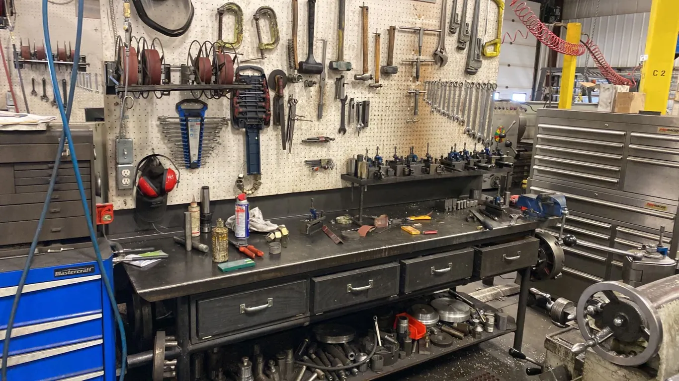 8' METAL WORK BENCH. 4' LIGHT, AIR HOSE REEL, EMERY PAPER DISPENSER, SET OF STANDARD COMBINATION