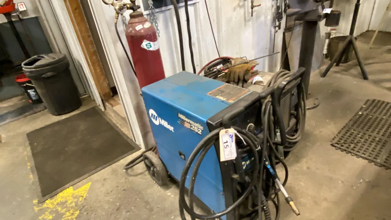 MILLER. MILLERMATIC 252 MIG WELDER. INC WELDING HELMET & EXTRA ROLL OF WIRE. TANK NOT INCLUDED.