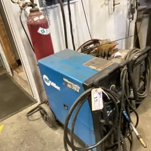 MILLER. MILLERMATIC 252 MIG WELDER. INC WELDING HELMET. TANK NOT INCLUDED.
