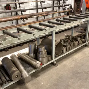16' ROLLER FEED TABLE. 35 1/2" HIGH. ADJUSTABLE LEVELERS.