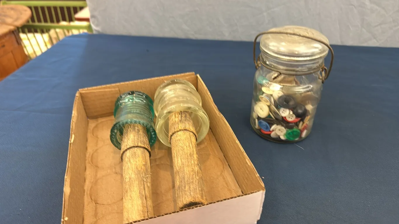 Insulators, jar of buttons