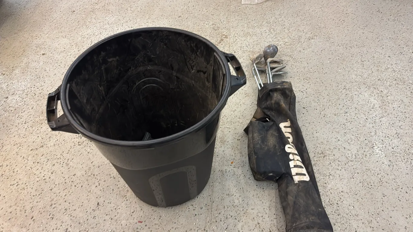 Garbage can, golf clubs