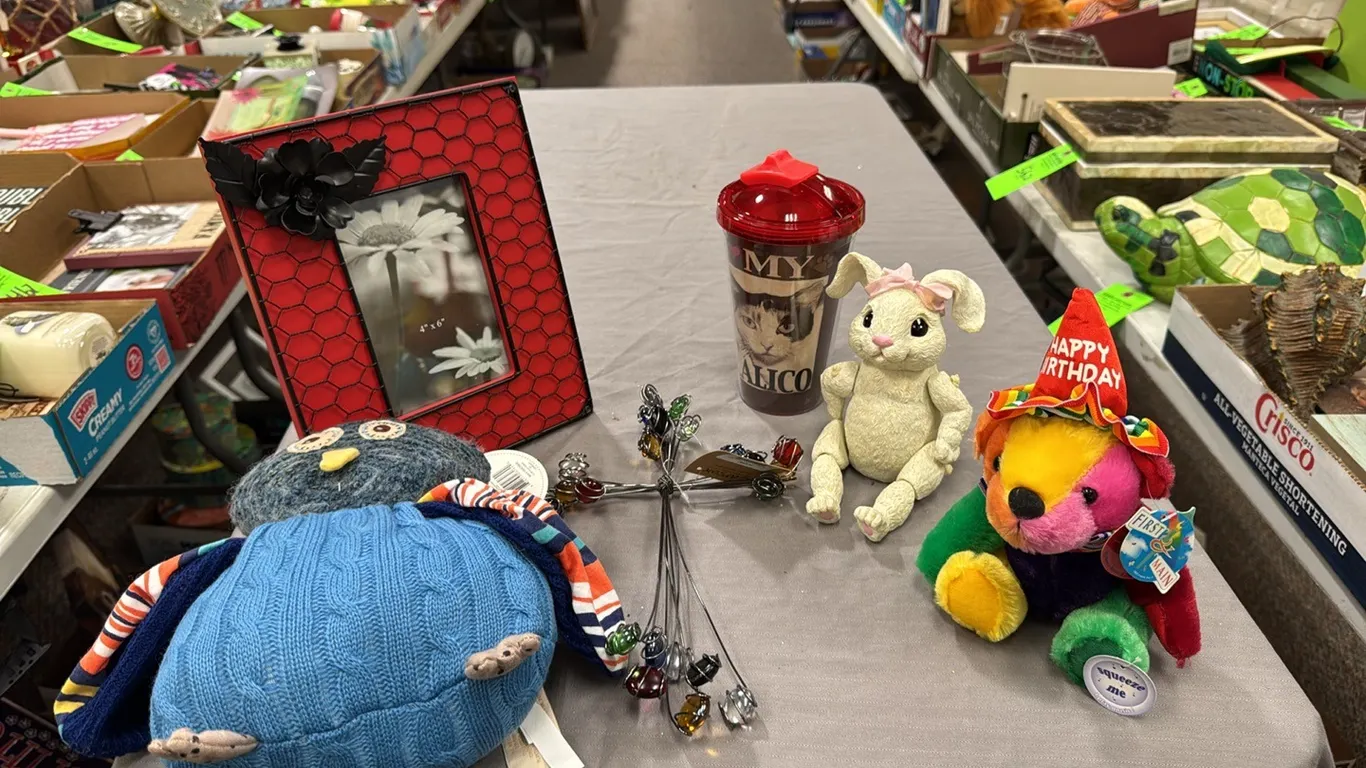 stuffed animals, drink glass, cross