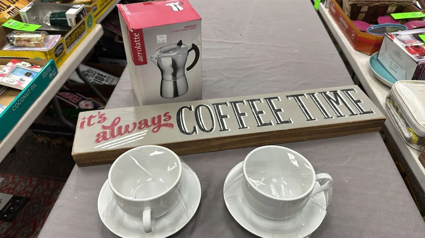 Espresso maker, cups, sign