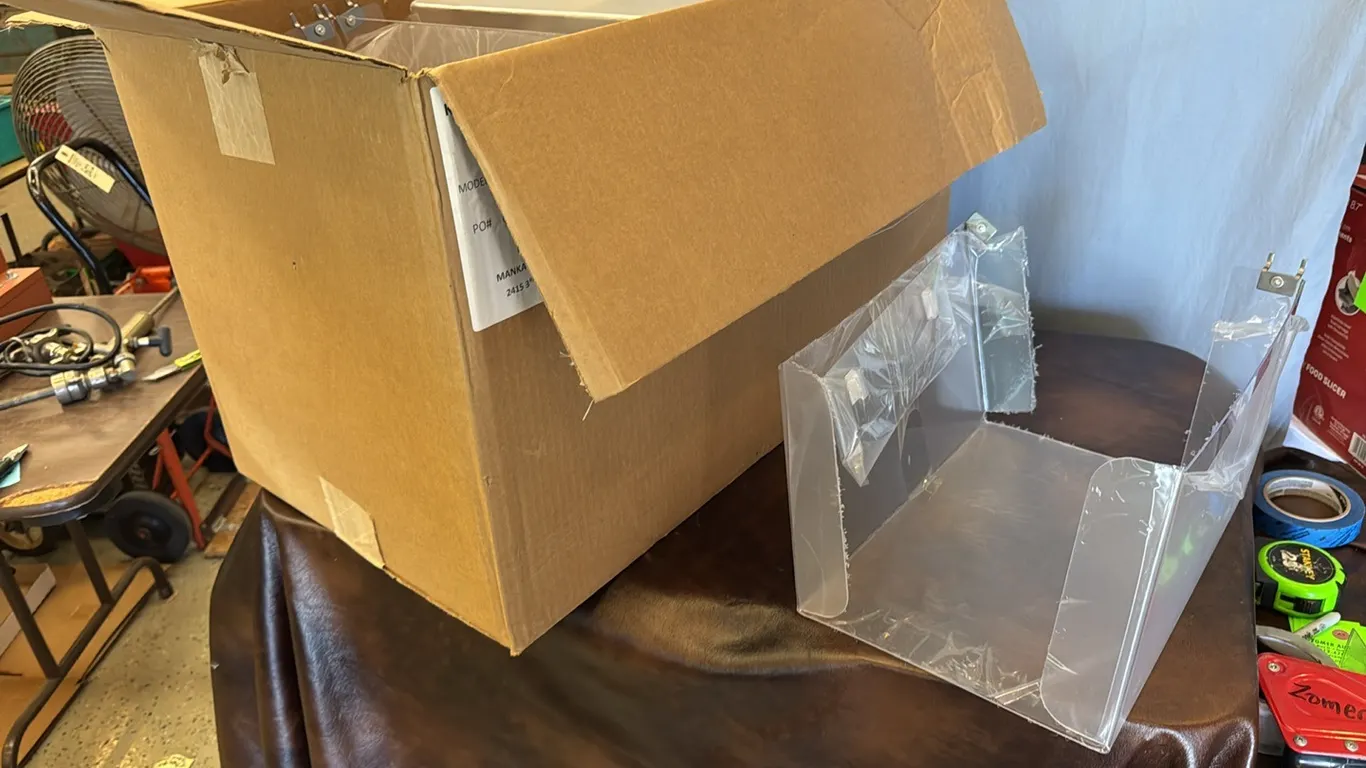 Box of peg board paint roller holders