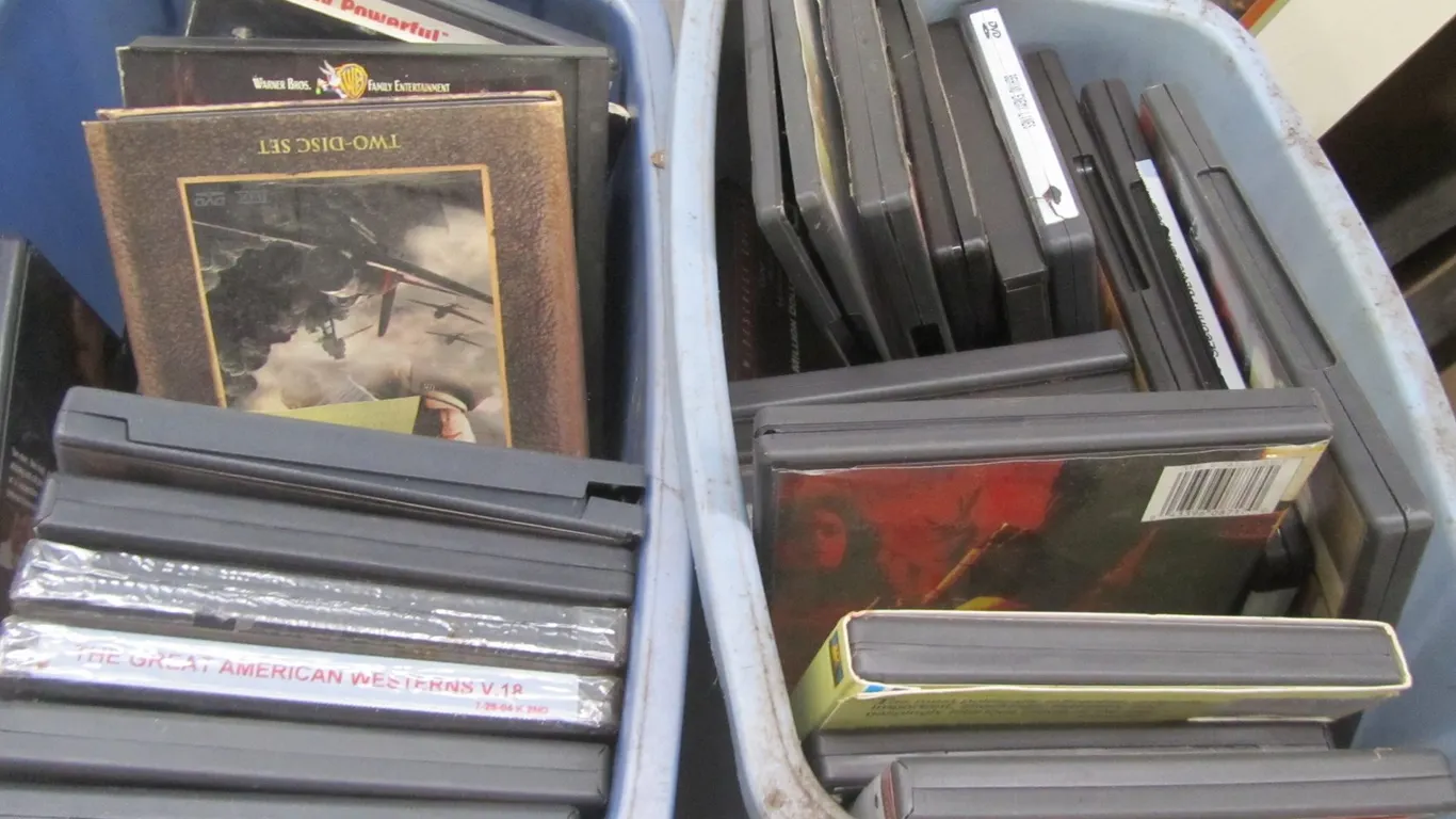 (2) Waste Bins Full Of Assorted DVDs