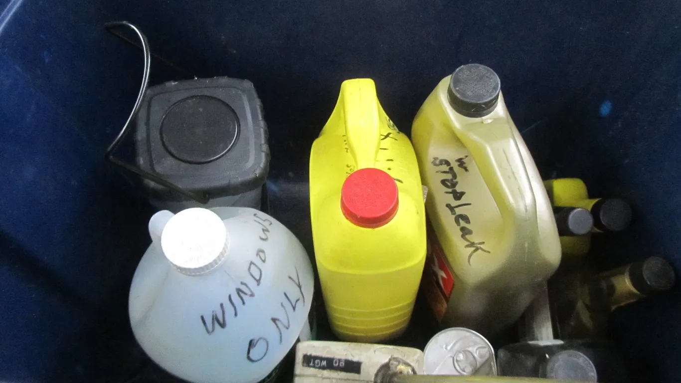 Tub Of Assorted Automotive Fluids