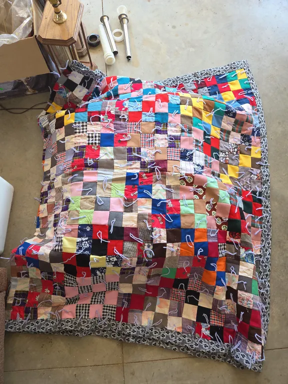 Primitive style twin size patchwork tie knot quilt