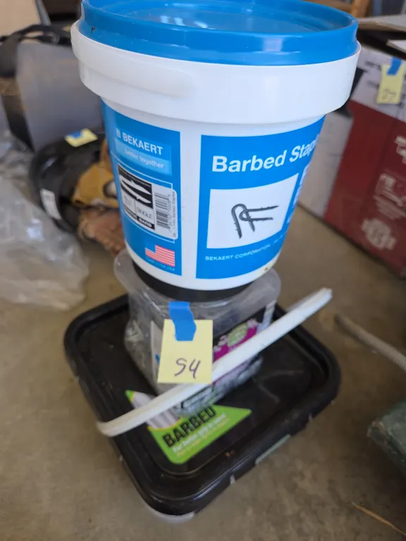 Assorted containers of fence Staples
