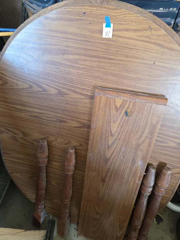 Wooden dining room table with one leaf