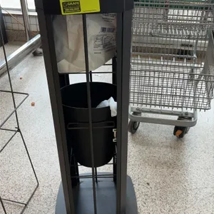 Purell sanitizing wipe dispensing station. Features top-loading wipe dispenser nozzle, integrated front waste receptacle slot, and internal trash cont