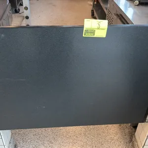 Wood laminate swing door. Features a black textured laminate finish and swinging hinge mounting hardware. 36"W.