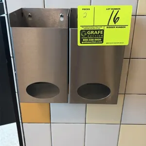 Stainless steel hair net dispensers. Features stainless steel construction, open-top loading, and front oval dispensing cutouts. Wall-mounted design.