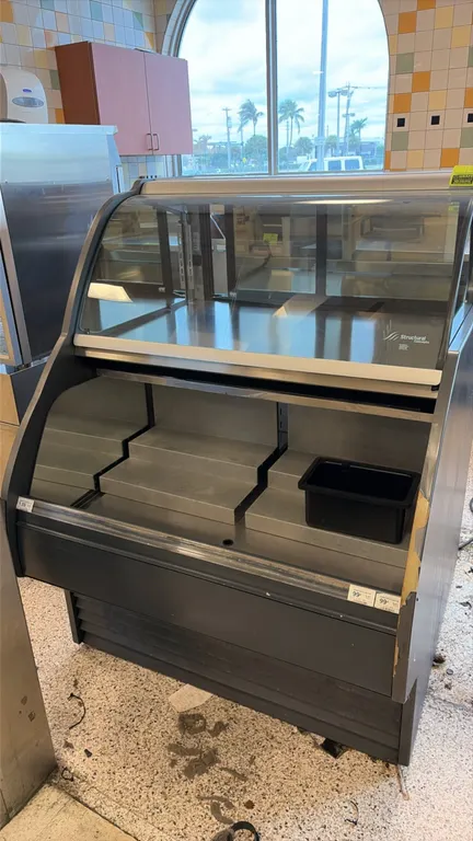 Structural Concepts HUDLR3852R.5520 self-contained refrigerated display case. Features an upper curved glass service section with rear sliding doors a